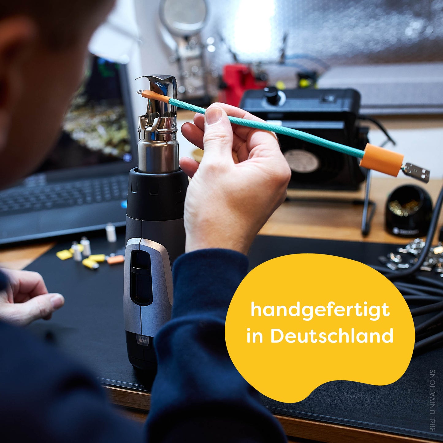 recables fair USB charging cable is made in Germany. Presentation: Cable maker René applies a heat shrink tube by hand using a hot air blower.