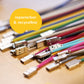recable is repairable & recyclable. Illustration: Numerous colorful recable with USB-A connectors without heat shrink tubing lie on a wooden table.